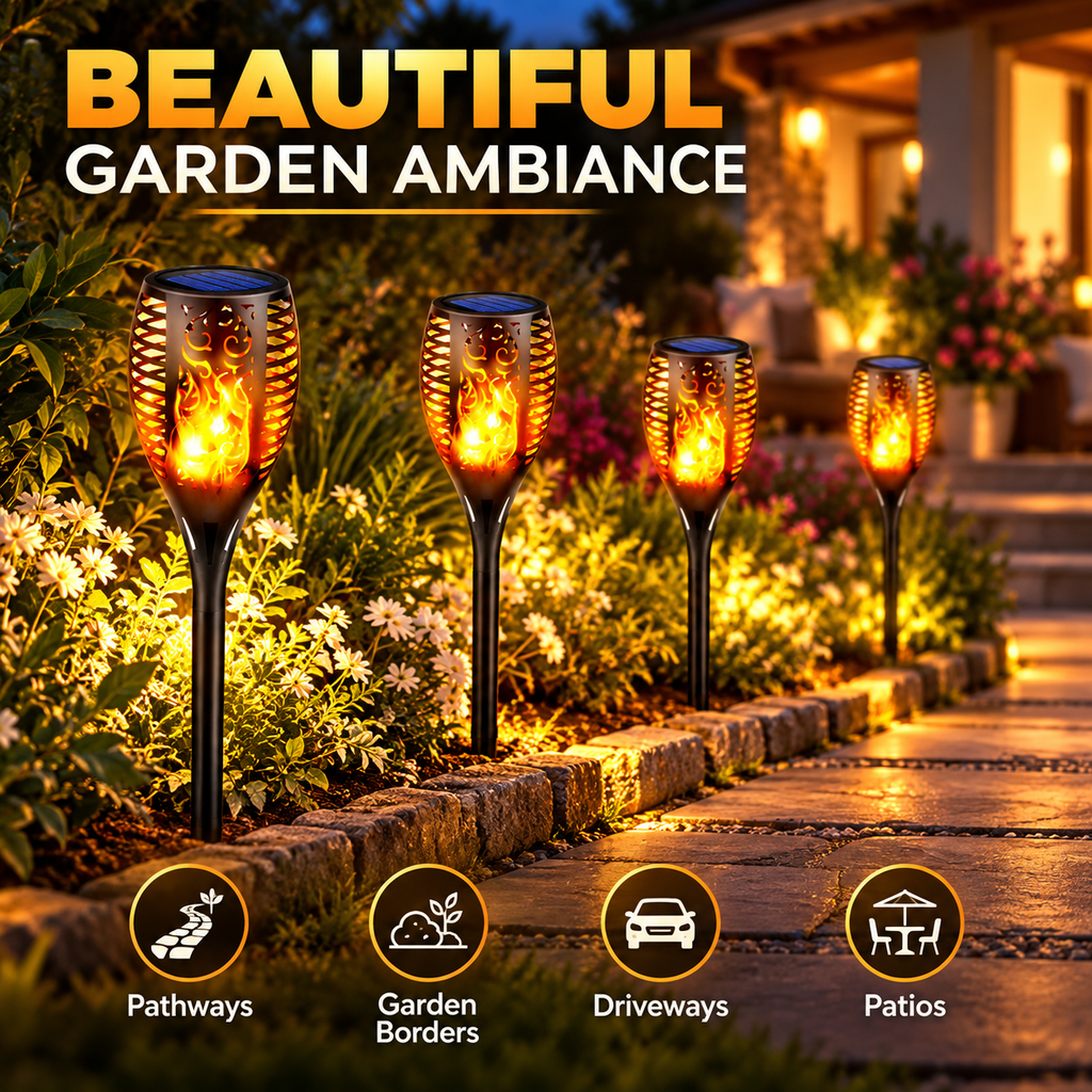 Aangan solar flame torches lighting a garden path and border at night